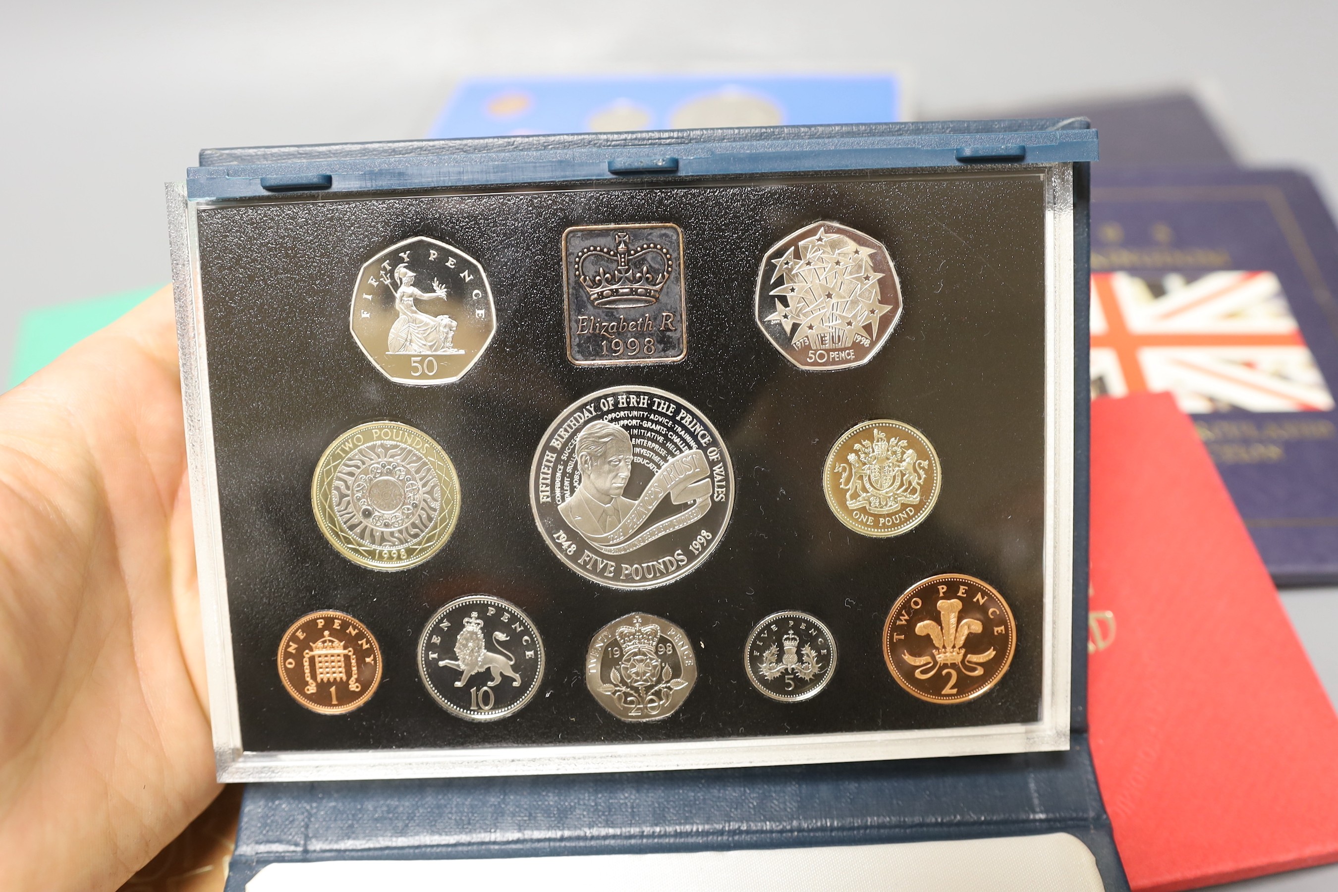 A group of UK Royal Mint BU year sets.